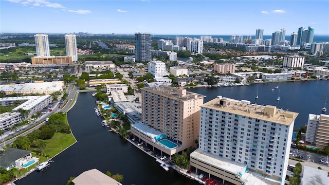 birds eye view of property featuring a water view and a city view