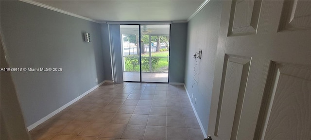 entryway featuring light tile patterned floors, baseboards, and crown molding