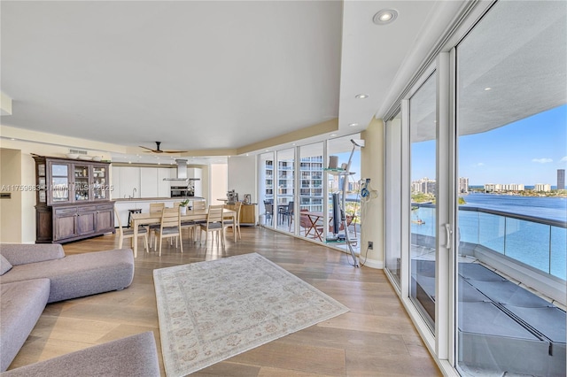 2600 E Island Blvd Unit 1704, Aventura, FL 33160 - living area featuring a ceiling fan, recessed lighting, a city view, and light wood-style flooring