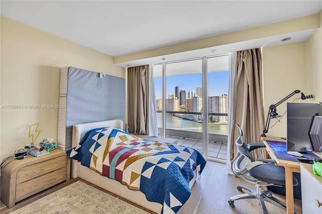 2600 E Island Blvd Unit 1704, Aventura, FL 33160 - bedroom with access to outside, wood finished floors, and an office area