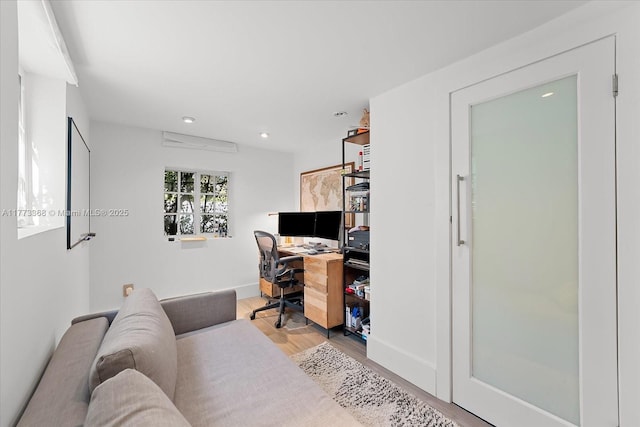office space with wood finished floors and recessed lighting
