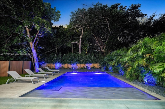 view of pool with a fenced backyard, a fenced in pool, and a patio