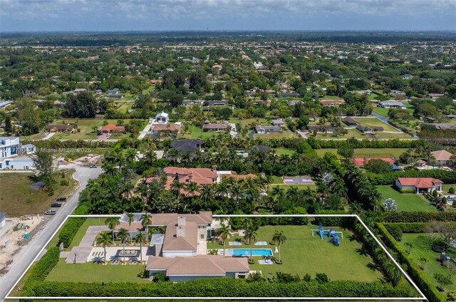 birds eye view of property with a residential view