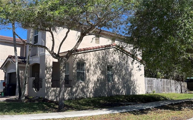 977 SW 153rd Path, Miami, FL 33194 - view of property exterior featuring a tile roof and stucco siding