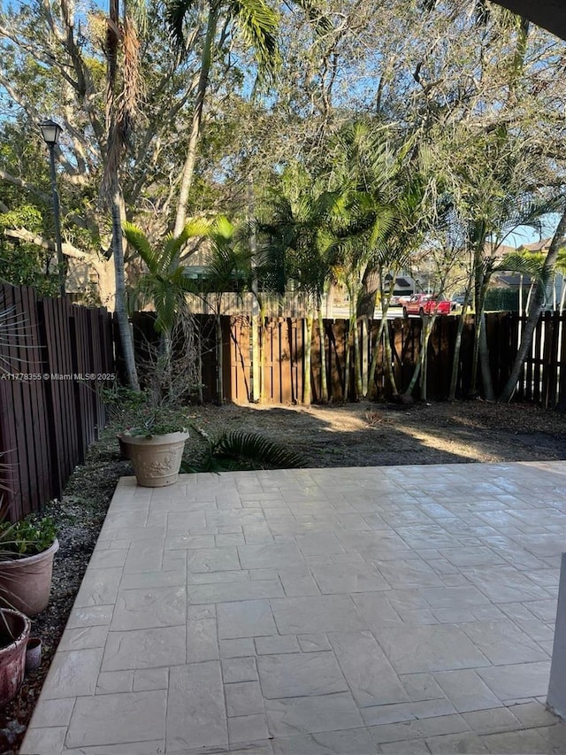 977 SW 153rd Path, Miami, FL 33194 - fenced backyard with a patio area