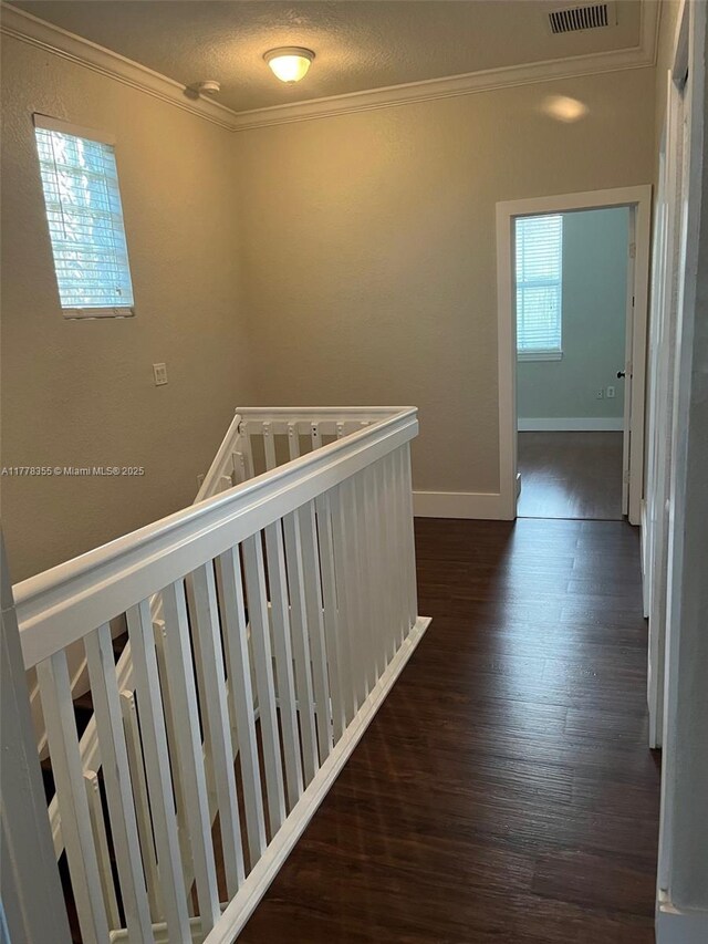 977 SW 153rd Path, Miami, FL 33194 - hall featuring crown molding, dark wood-type flooring, an upstairs landing, and baseboards