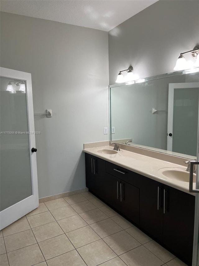 977 SW 153rd Path, Miami, FL 33194 - full bathroom with tile patterned floors, double vanity, and baseboards