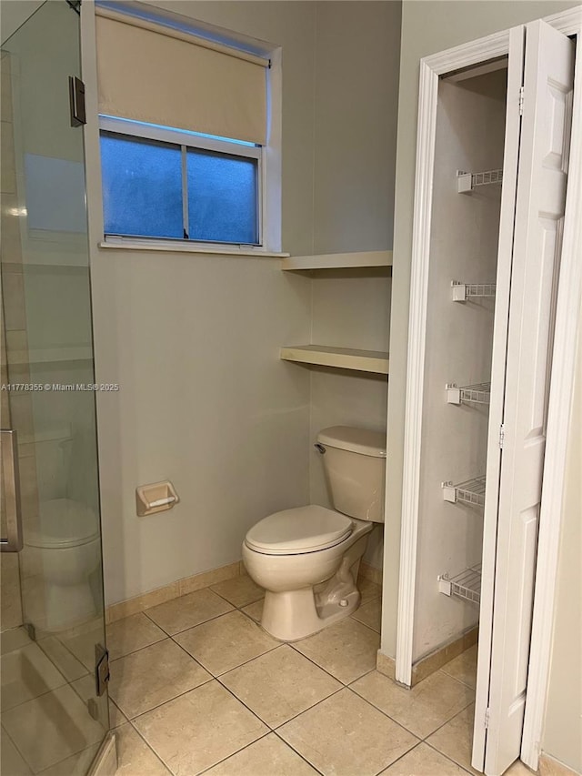 977 SW 153rd Path, Miami, FL 33194 - full bath featuring toilet, baseboards, a shower stall, and tile patterned flooring