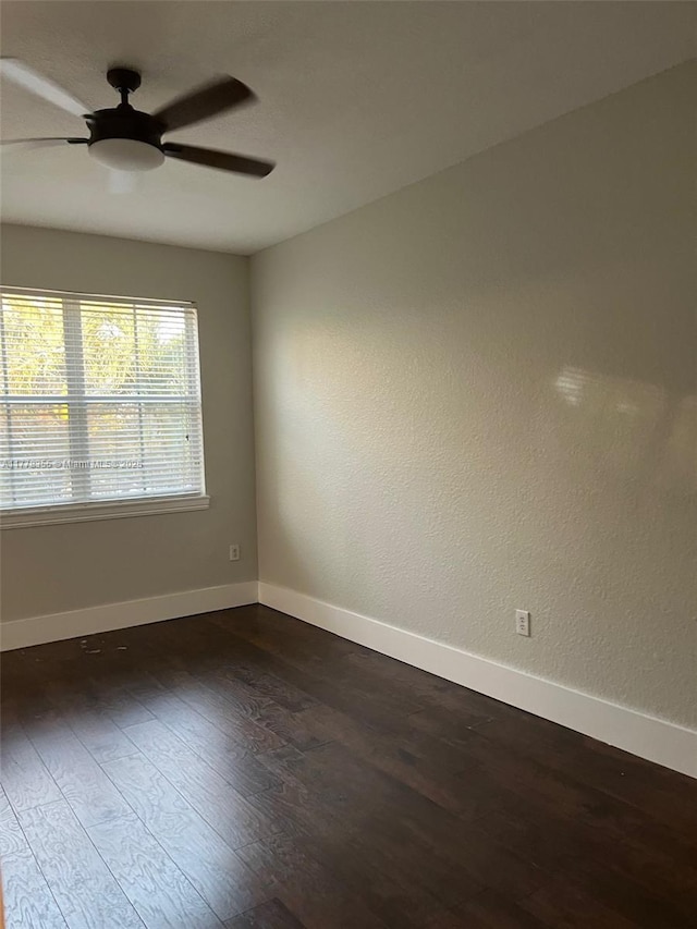 977 SW 153rd Path, Miami, FL 33194 - unfurnished room featuring dark wood-style floors, baseboards, and a ceiling fan