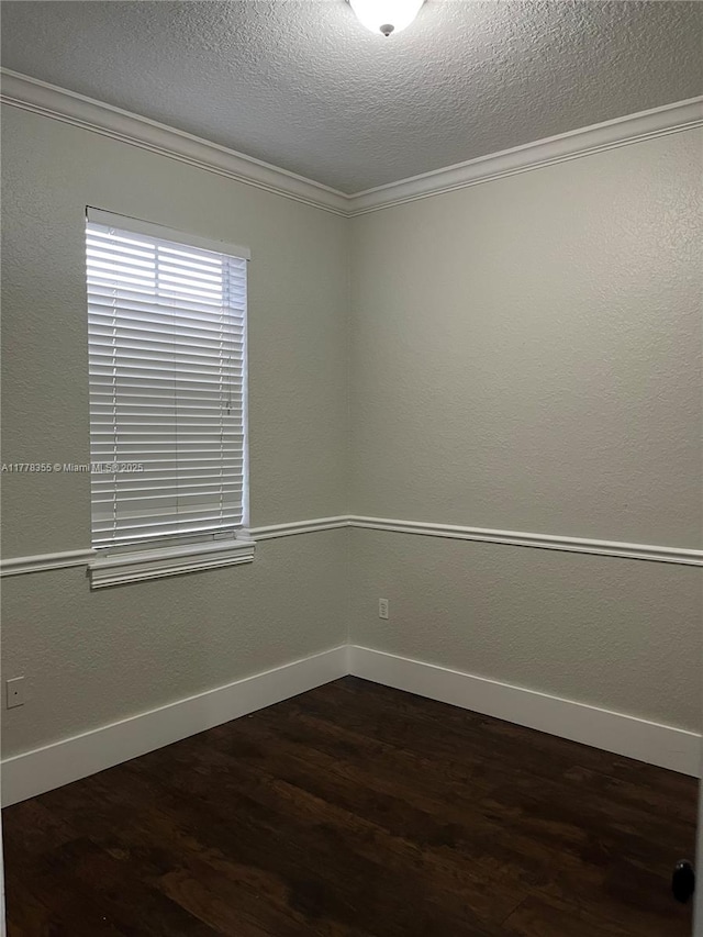 977 SW 153rd Path, Miami, FL 33194 - spare room with dark wood-type flooring, baseboards, crown molding, and a textured ceiling