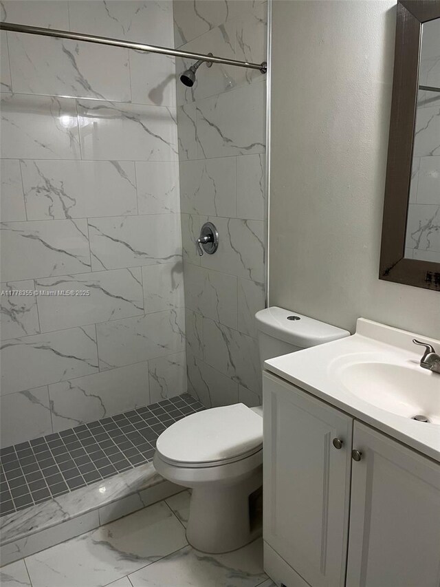 977 SW 153rd Path, Miami, FL 33194 - full bath featuring vanity, marble look tiles, toilet, and a marble finish shower