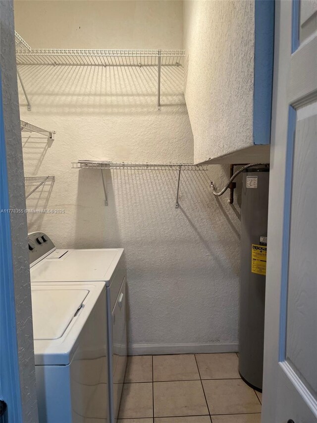 977 SW 153rd Path, Miami, FL 33194 - laundry room with independent washer and dryer, a textured wall, water heater, and light tile patterned floors