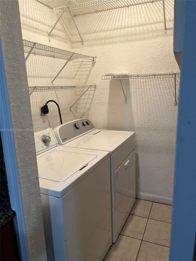 977 SW 153rd Path, Miami, FL 33194 - washroom with independent washer and dryer, light tile patterned flooring, and a textured wall
