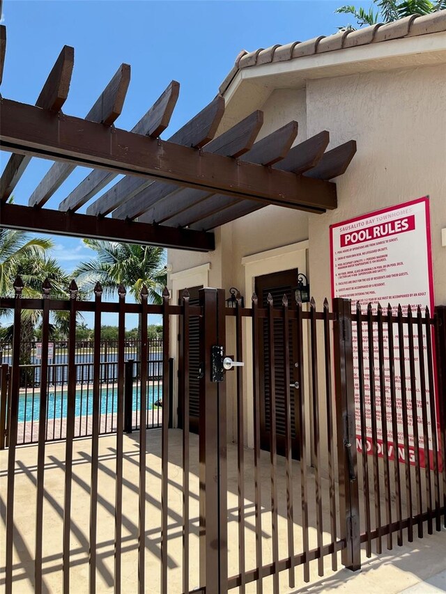 977 SW 153rd Path, Miami, FL 33194 - gate with a community pool and a pergola