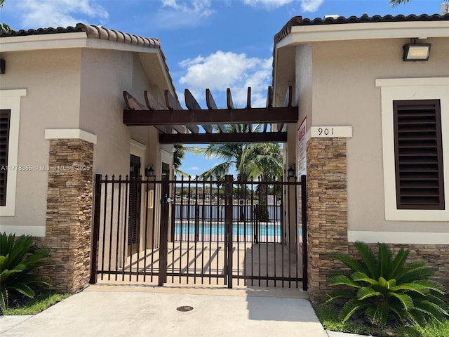 977 SW 153rd Path, Miami, FL 33194 - gate featuring a community pool