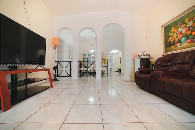 14426 NW 88th Ave, Miami Lakes, FL 33018 - living area with arched walkways, tile patterned flooring, and high vaulted ceiling