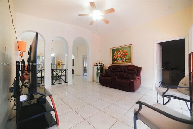 14426 NW 88th Ave, Miami Lakes, FL 33018 - living room with arched walkways, light tile patterned flooring, a ceiling fan, and lofted ceiling