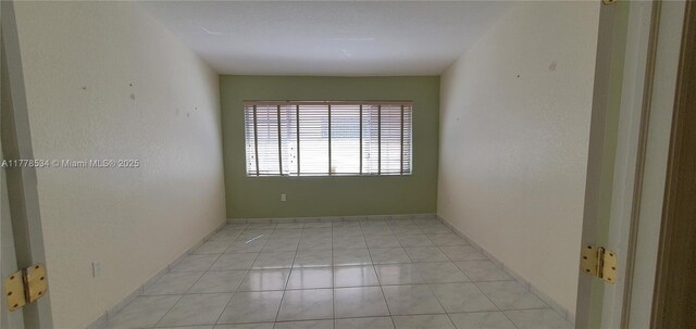 14426 NW 88th Ave, Miami Lakes, FL 33018 - empty room with light tile patterned floors