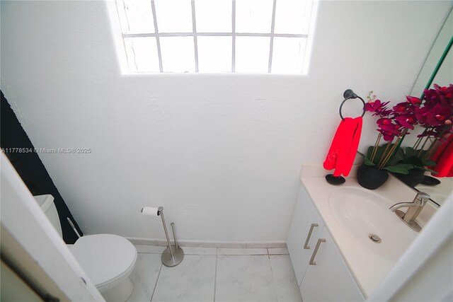 14426 NW 88th Ave, Miami Lakes, FL 33018 - bathroom featuring vanity, toilet, and tile patterned flooring