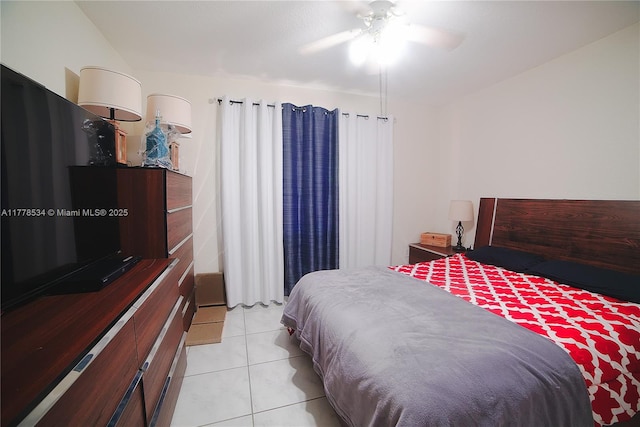 14426 NW 88th Ave, Miami Lakes, FL 33018 - bedroom featuring light tile patterned floors and a ceiling fan