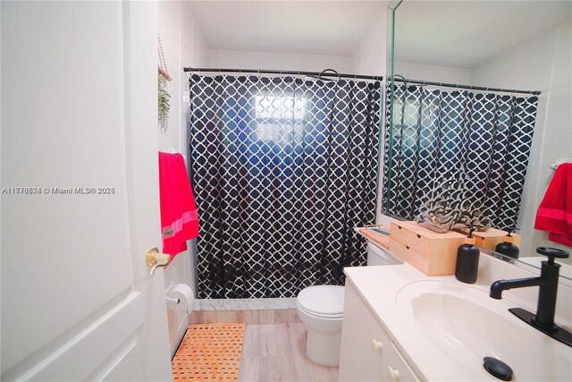 14426 NW 88th Ave, Miami Lakes, FL 33018 - bathroom with vanity, toilet, and curtained shower