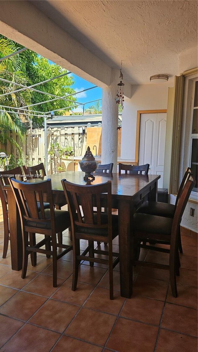 14426 NW 88th Ave, Miami Lakes, FL 33018 - dining area featuring tile patterned floors and a textured ceiling