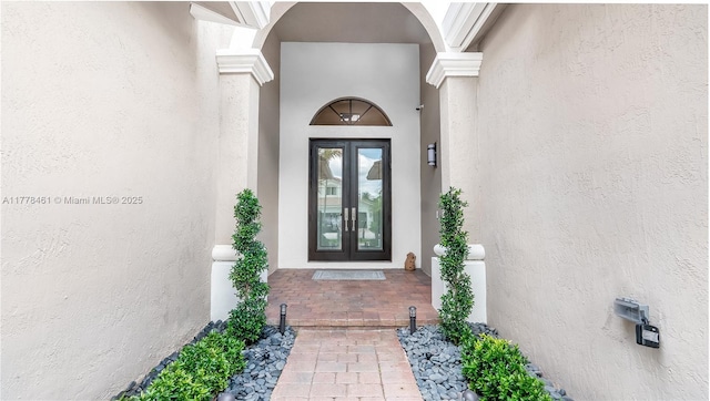 2269 Quail Roost Dr, Weston, FL 33327 - property entrance with french doors and stucco siding