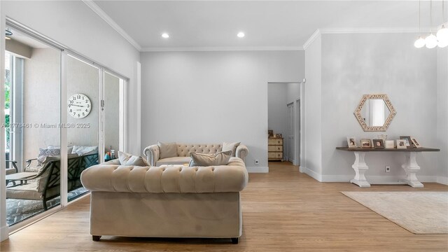 2269 Quail Roost Dr, Weston, FL 33327 - living area featuring ornamental molding, light wood-type flooring, baseboards, and recessed lighting