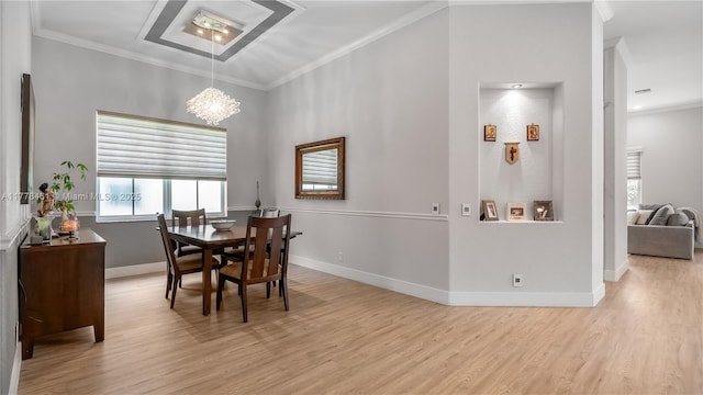 2269 Quail Roost Dr, Weston, FL 33327 - dining room featuring light wood-type flooring, crown molding, a chandelier, and baseboards