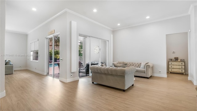 2269 Quail Roost Dr, Weston, FL 33327 - living area featuring light wood-type flooring, baseboards, recessed lighting, and ornamental molding