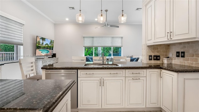 2269 Quail Roost Dr, Weston, FL 33327 - kitchen with a sink, stainless steel dishwasher, ceiling fan, crown molding, and backsplash