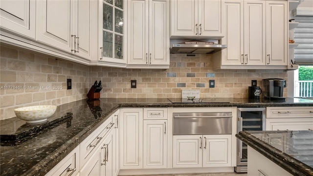 2269 Quail Roost Dr, Weston, FL 33327 - kitchen with a warming drawer, beverage cooler, tasteful backsplash, glass insert cabinets, and under cabinet range hood