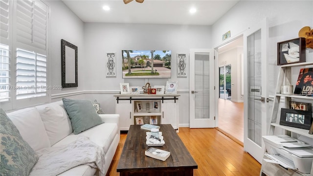 2269 Quail Roost Dr, Weston, FL 33327 - living room featuring french doors, wood finished floors, healthy amount of natural light, and recessed lighting