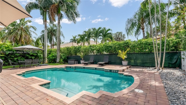 2269 Quail Roost Dr, Weston, FL 33327 - view of swimming pool with a patio and fence