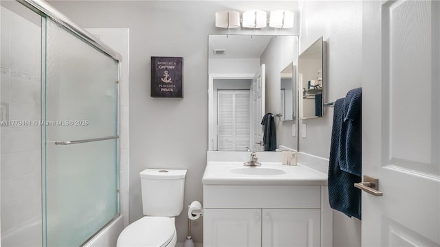 2269 Quail Roost Dr, Weston, FL 33327 - full bathroom featuring toilet, vanity, and bath / shower combo with glass door