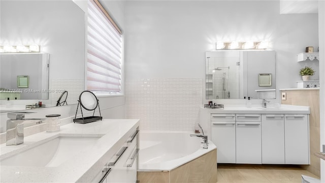 2269 Quail Roost Dr, Weston, FL 33327 - bathroom with a stall shower, two vanities, a bath, and tile patterned floors