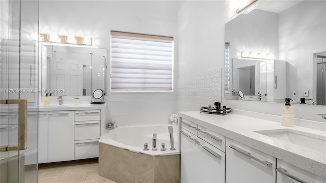 2269 Quail Roost Dr, Weston, FL 33327 - full bath featuring a garden tub, vanity, and tile patterned flooring