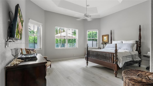 2269 Quail Roost Dr, Weston, FL 33327 - bedroom with a raised ceiling, light wood finished floors, baseboards, and ceiling fan
