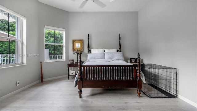 2269 Quail Roost Dr, Weston, FL 33327 - bedroom featuring multiple windows, wood finished floors, and baseboards