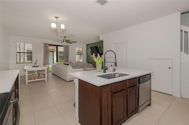 1091 NW 33rd Ct, Pompano Beach, FL 33064 - kitchen featuring light tile patterned floors, light countertops, visible vents, dishwasher, and a sink