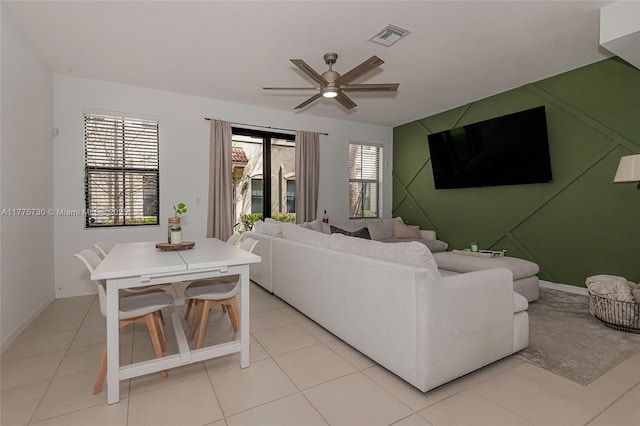1091 NW 33rd Ct, Pompano Beach, FL 33064 - living room featuring light tile patterned floors, ceiling fan, visible vents, and a wealth of natural light