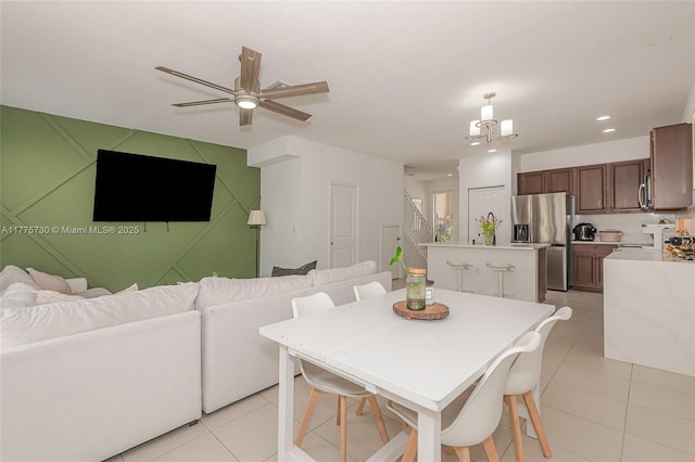1091 NW 33rd Ct, Pompano Beach, FL 33064 - dining area featuring light tile patterned floors, recessed lighting, stairs, and ceiling fan with notable chandelier