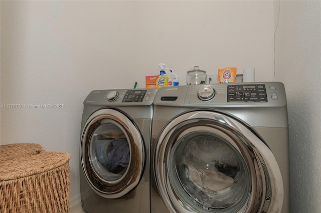1091 NW 33rd Ct, Pompano Beach, FL 33064 - washroom with laundry area and washer and clothes dryer