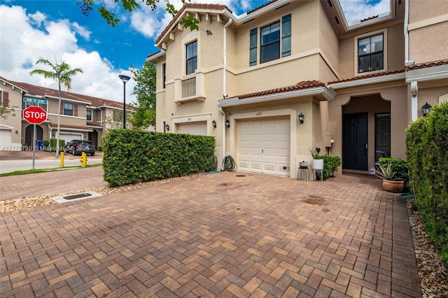1091 NW 33rd Ct, Pompano Beach, FL 33064 - view of front facade featuring stucco siding, decorative driveway, and an attached garage