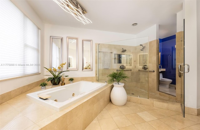 full bathroom with a jetted tub, tile patterned flooring, a stall shower, and toilet