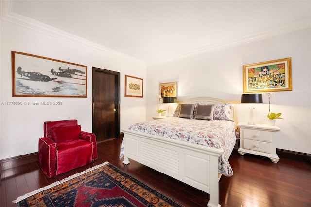 bedroom with crown molding, baseboards, and dark wood-style flooring