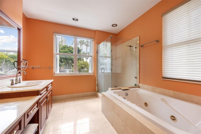 full bath with vanity, a whirlpool tub, tile patterned floors, and a shower stall