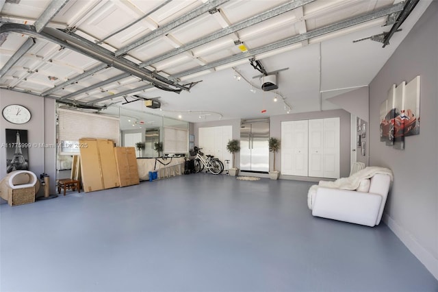 garage featuring baseboards and a garage door opener