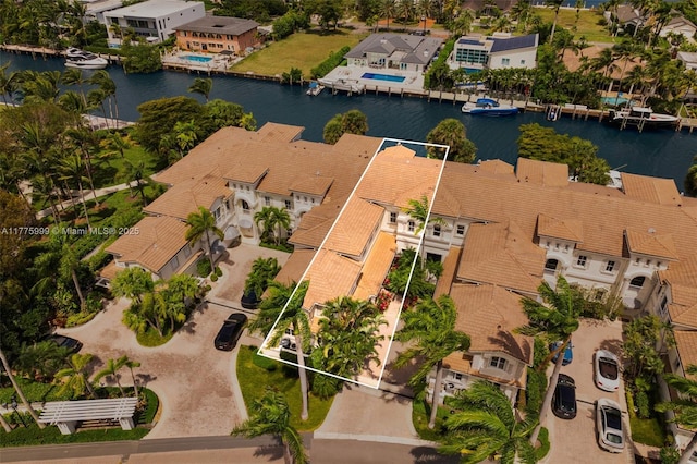 aerial view featuring a residential view and a water view