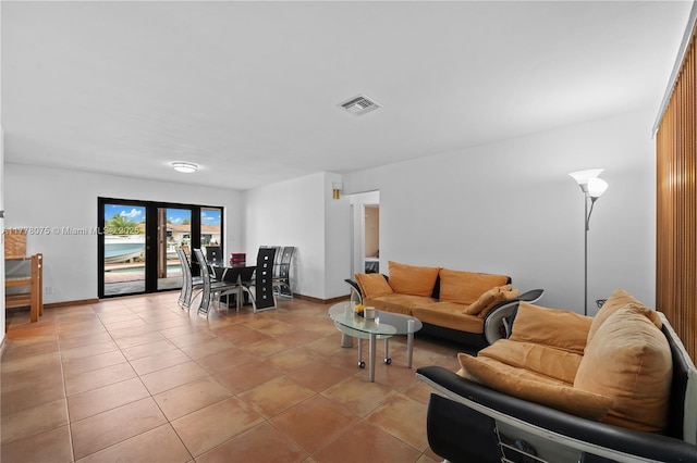 2447 SE 15th St, Pompano Beach, FL 33062 - living room featuring light tile patterned flooring, baseboards, and visible vents